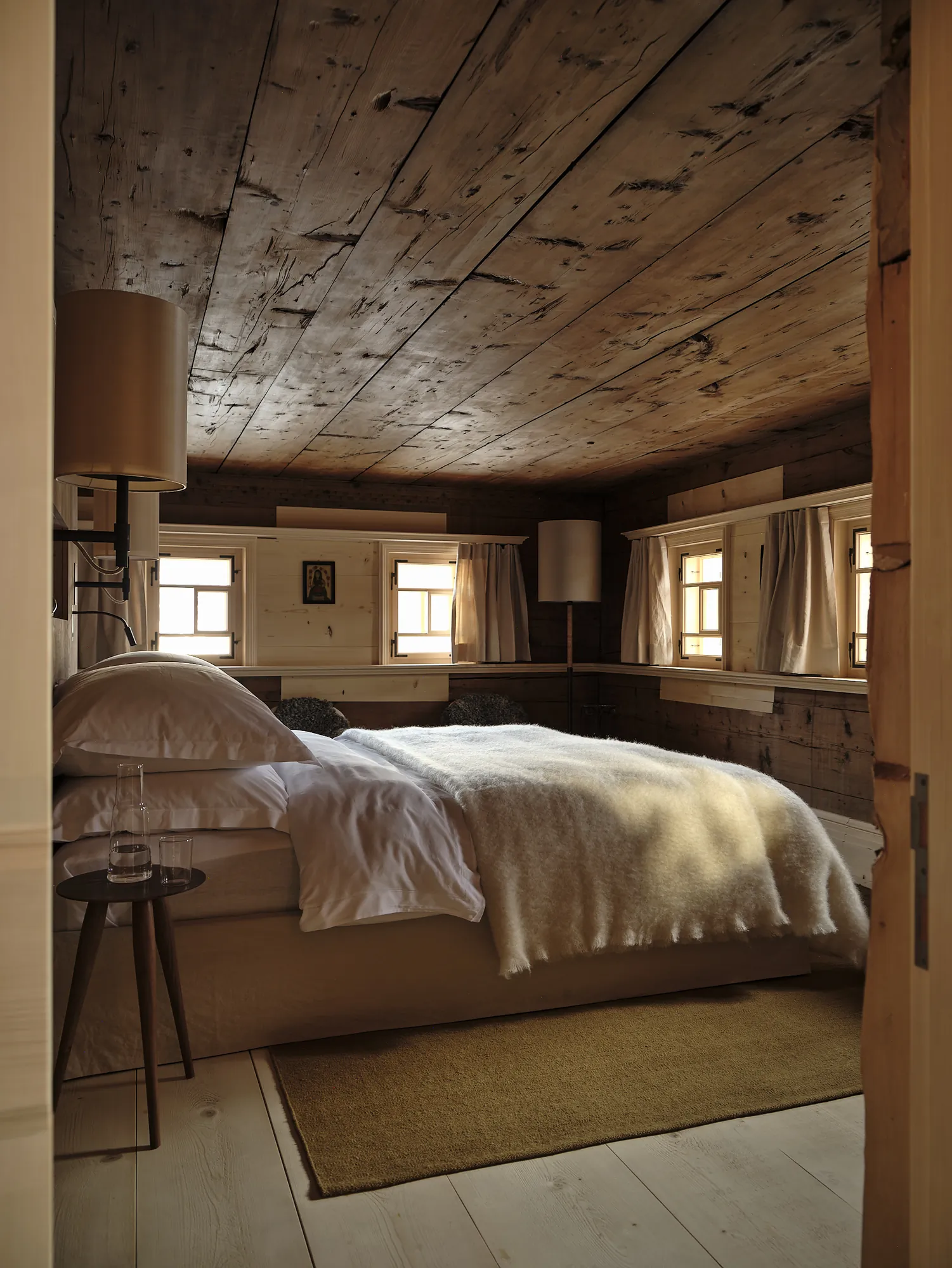 Cozy bedroom with wooden walls and small windows in Rafter Lech Zug, Lech, Austria