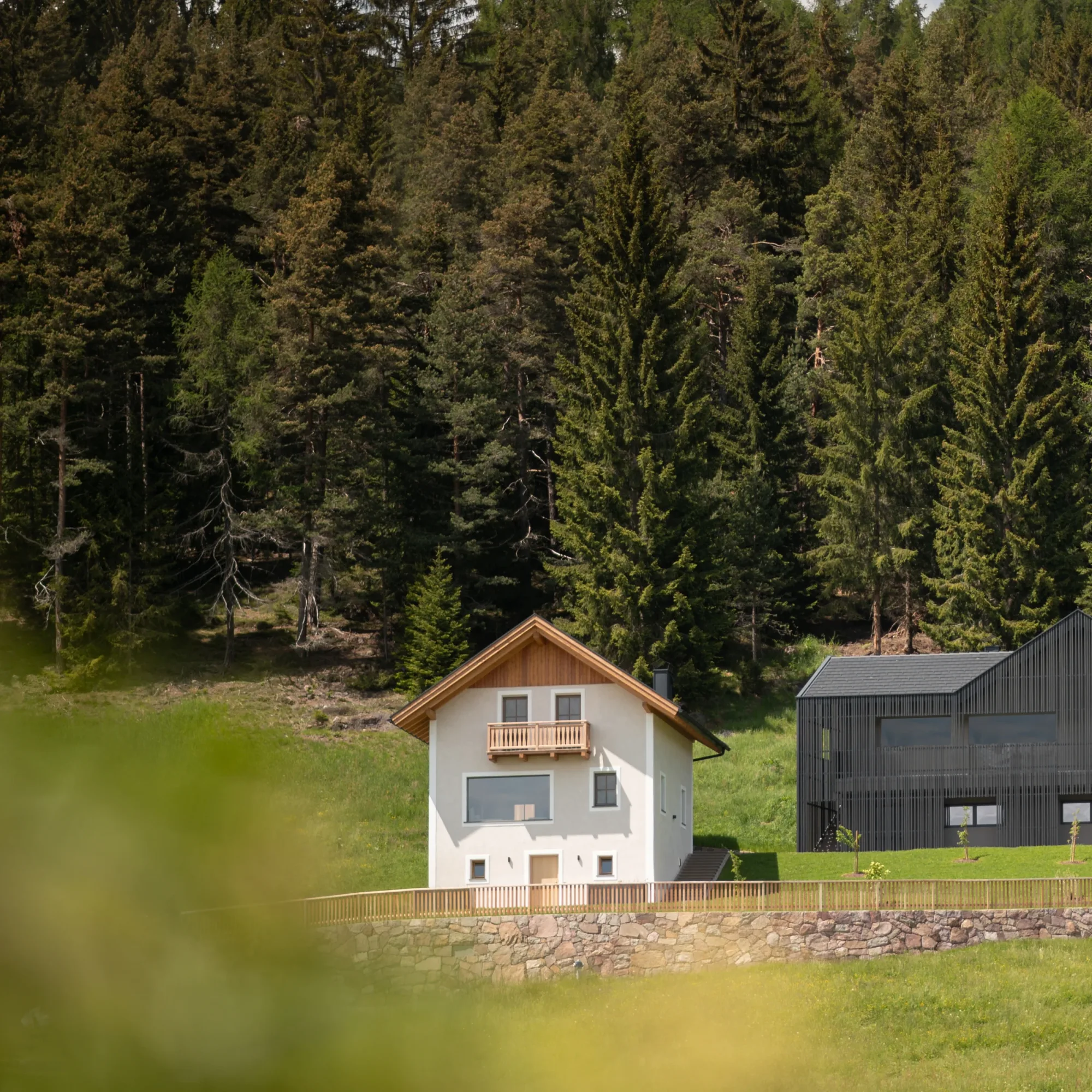 Rafter Bolzano Ritten holiday rental exterior with forest backdrop in Oberinn, Italy near mountain escape